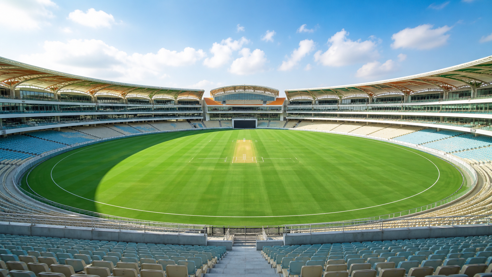 Bright upper-level view across a modern cricket stadium